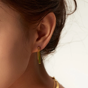 Golden chunky croissant rectangular hoop earrings in stainless steel on female model