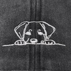 Washed cotton baseball cap featuring minimalist white puppy embroidery in dark grey