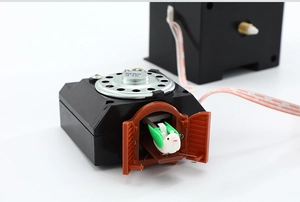 Macro shot of cuckoo clock electronic movement with built-in bird and 8 ohm speaker