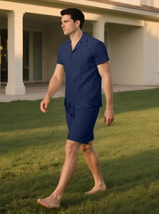 Outdoor shot of men's navy blue textured vertical stripe shirt and shorts set