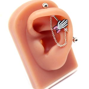 Silver industrial barbell earring with pink bow skull hand charm and dangling chain