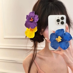Floral frangipani hair clip and phone grip set in purple, yellow and blue colors