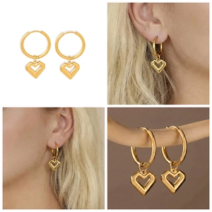 Detail view of gold-plated 18k heart pendant hoop earrings in minimalist style