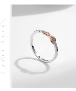 Detailed view of S925 silver infinity ring with rose gold plating and inlaid pavé diamonds