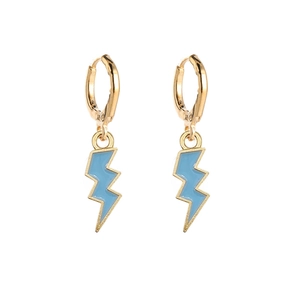 Macro detail of sky blue lightning bolt pendants on golden hoop earrings set