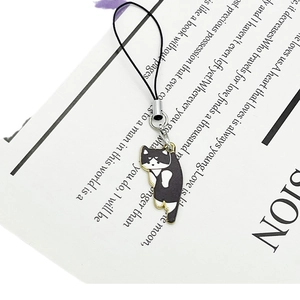 Cartoon black and white cat charm with enamel finish and black phone lanyard strap