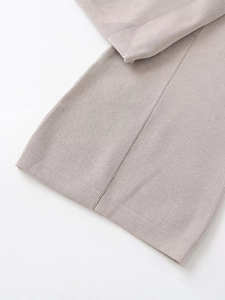 Close-up of high-quality light grey knit sweatshirt showing fine texture and neat stitching