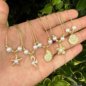 5-teiliges goldenes Ozean-Halsketten-Set mit Seestern-, Seepferdchen- und Muschelanhängern