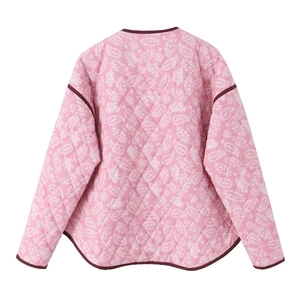 Detail of pink paisley quilted jacket featuring contrast dark red trim and curved hemline