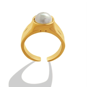 Minimalist adjustable gold ring with a large white pearl and textured thick band