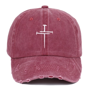 Vintage distressed baseball cap in dark red with cross embroidery and worn edges