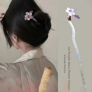 Detail of icy purple glass flower hair stick and model wearing for elegant hairstyle