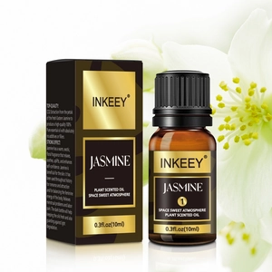 Premium 10ml jasmine essential oil bottle with black and gold packaging on reflective surface
