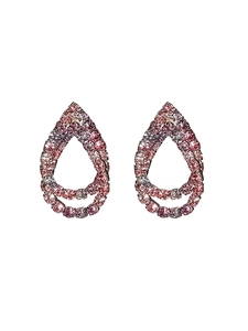 Macro shot of luxury teardrop earrings with pink and purple gradient crystals and rhodium finish