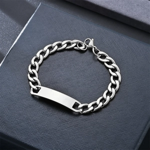 Detailed close-up of a silver stainless steel Cuban link bracelet with a blank ID tag