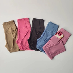 Detailed view of high-waisted yoga leggings with side pockets in five assorted colors