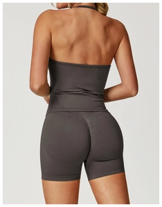 Rear view of seamless charcoal yoga set featuring halter top and high-waist shorts