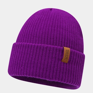 Detail shot of purple ribbed beanie showing thick texture and brown leather label
