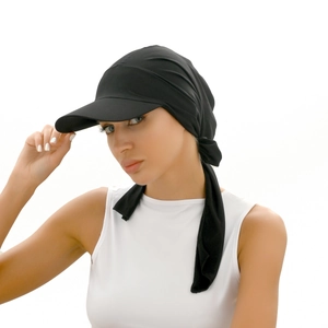 Chic black headscarf hat with sun visor and bow detail shown on a female model