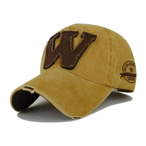 Detail of vintage mustard yellow baseball cap with W patch and distressed embroidery