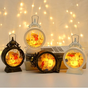 Macro detail of LED Christmas lanterns with Santa and Snowman motifs in warm festive light