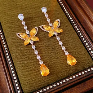 Luxury butterfly tassel earrings with yellow zircon crystals and gold-plated finish