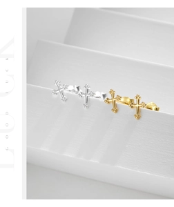 Detail view of mini S925 sterling silver cross studs showing hallmark and vintage texture