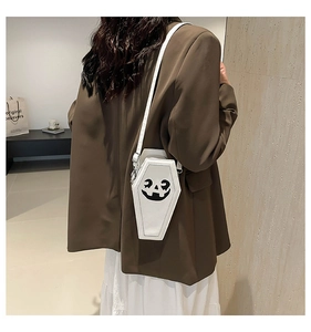 White coffin-shaped crossbody bag with Jack O' Lantern pumpkin print detail on high-quality PU