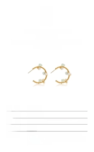 Detailed view of handmade baroque pearl and green gemstone S925 silver earrings