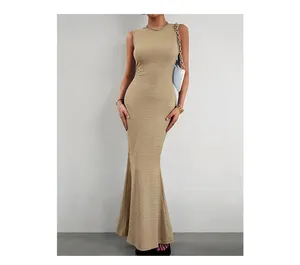 Detail of khaki slim fit knitted dress featuring textured fabric and fishtail hemline
