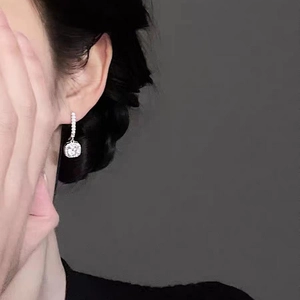 Square cushion cut S925 sterling silver drop earrings with halo diamond setting on model