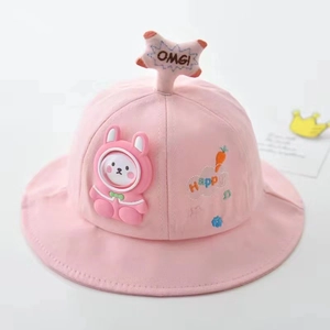 Close-up of pink baby sun hat featuring 3D rabbit character and Happy embroidery detail