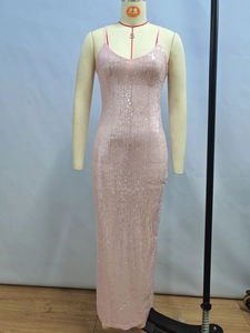 Detailed view of pink sequin fabric and fish-tail hem on a backless evening dress