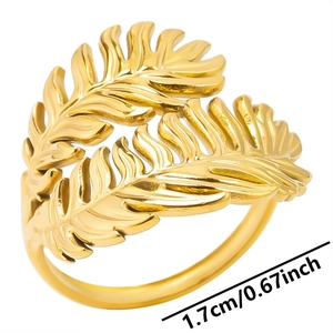 Detail shot of golden leaf ring showing 1.7cm width dimensions on white background