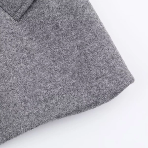 Close-up macro view of high-quality grey wool fabric texture and soft fiber details