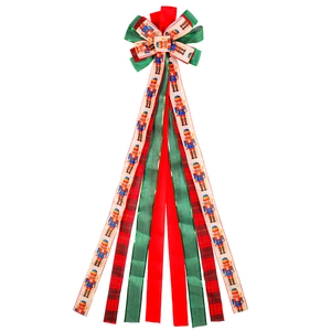 Nœud de Noël Casse-Noisette avec rubans rouges, verts et à carreaux sur fond blanc