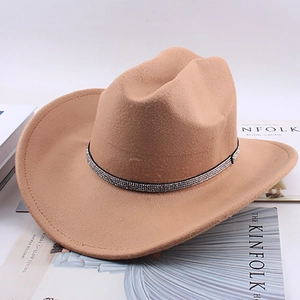 Macro detail of khaki felt cowboy hat with sparkling silver rhinestone hatband