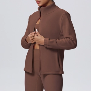 Close-up of slim-fit dark brown zip-up sports jacket with stand collar and thumb holes