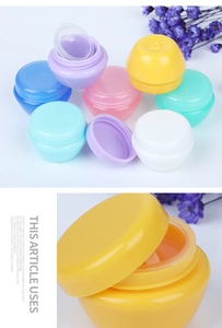 Macro view of macaron colored mushroom cream jars with leak-proof inner lids and caps