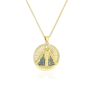 Macro shot of gold-plated Virgin Mary pendant with blue zircons and sparkling detail