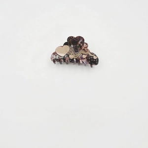 Star and moon acetate hair claw clip with heart pattern on white background