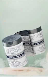 Detail of disposable face towel roll featuring floral print and blue branding wrap
