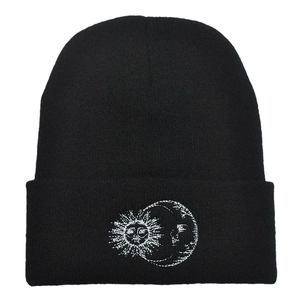 Winter black cuffed beanie with white sun and moon embroidery for outdoor warmth