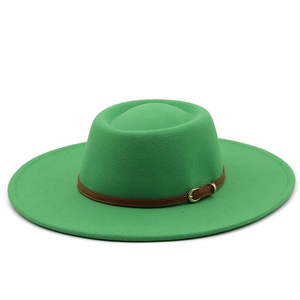 Detailed view of the green wool felt hat featuring a brown leather strap and gold buckle