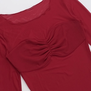 Close-up of red sheer mesh top showing ruched chest detail and delicate fabric texture