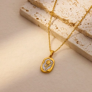 Elegant 18K gold titanium steel tulip flower pendant necklace for women shown on stone