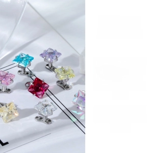 Macro shot of colorful square-cut zircon dermal anchors on medical steel bases