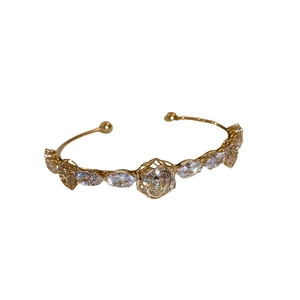 Elegant 14k gold plated open bangle featuring marquise zircon and hollow flower design