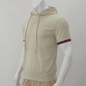 Detail of waffle knit fabric and red plaid patchwork on short sleeve hooded t-shirt