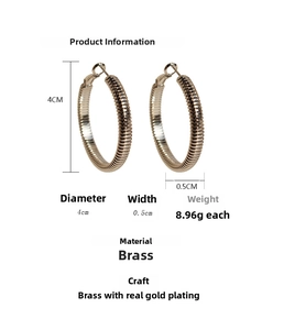 Detail view of 4cm gold spiral hoop earrings with dimensions and weight specifications